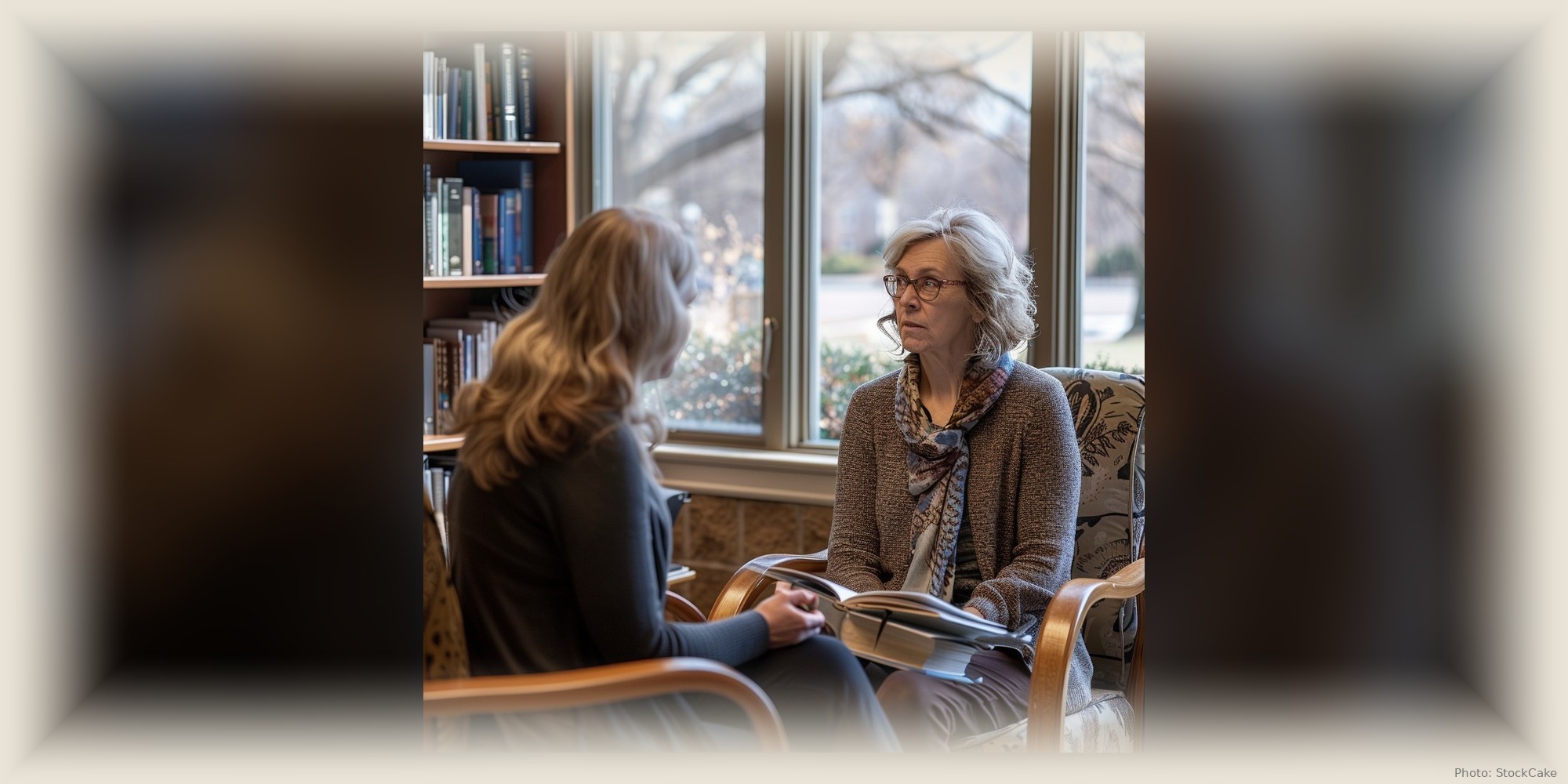Two women lean into a quiet, unhurried conversation across a table.