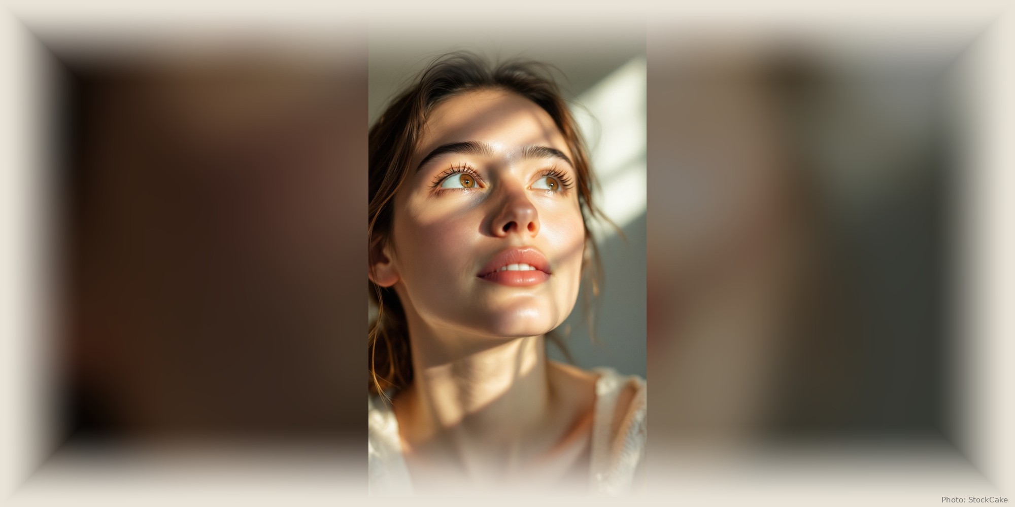 A woman sits in still, prayerful light, eyes lifted, at peace.